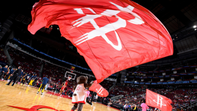 Houston Rockets mascot waving flag with logo
