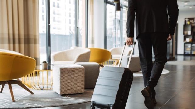 man-in-hotel-with-suitcase.jpg