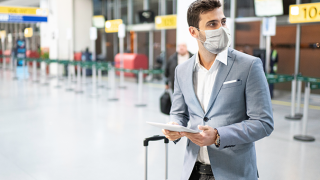 Man at airport in mask