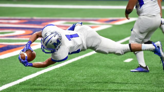 football player catching a football