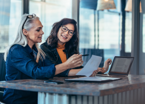 two ladies making notes