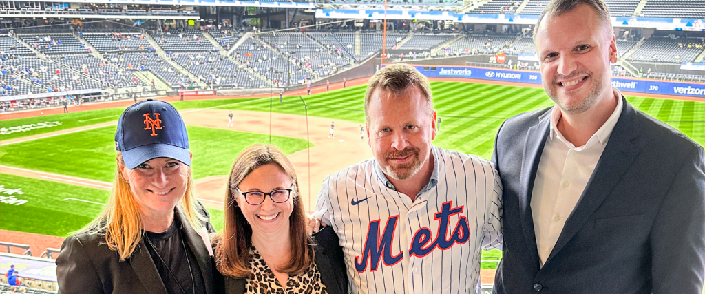 Charlene Leiss, Jen Bankard, John Van den Heuvel, Michael Laumanns standing at Mets stadium