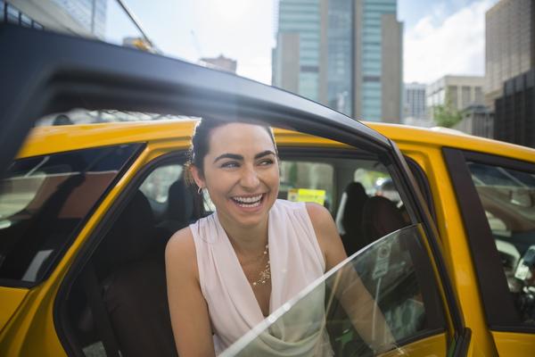 woman getting out of car