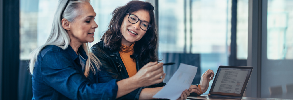 two ladies making notes