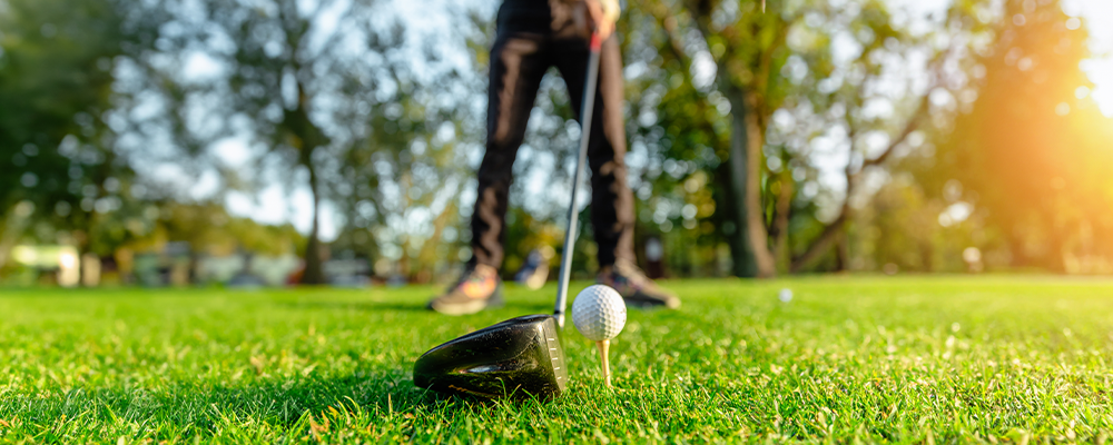 Golf club and ball on tee