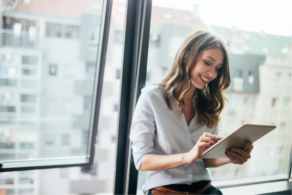 woman looking at tablet